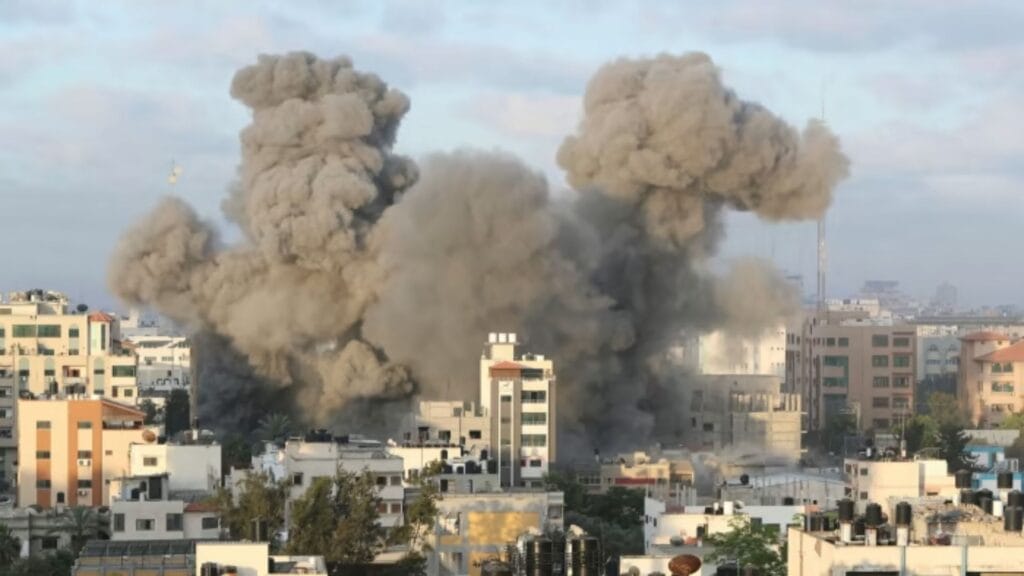 Smoke billows into the sky after an Israeli airstrike on Gaza City Tuesday