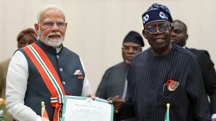 Nigerian President Bola Ahmed Tinubu presents Nigeria’s second-highest honor, the Grand Commander of the Order of the Niger (GCON), to Prime Minister Narendra Modi during a ceremony in Abuja on Sunday.