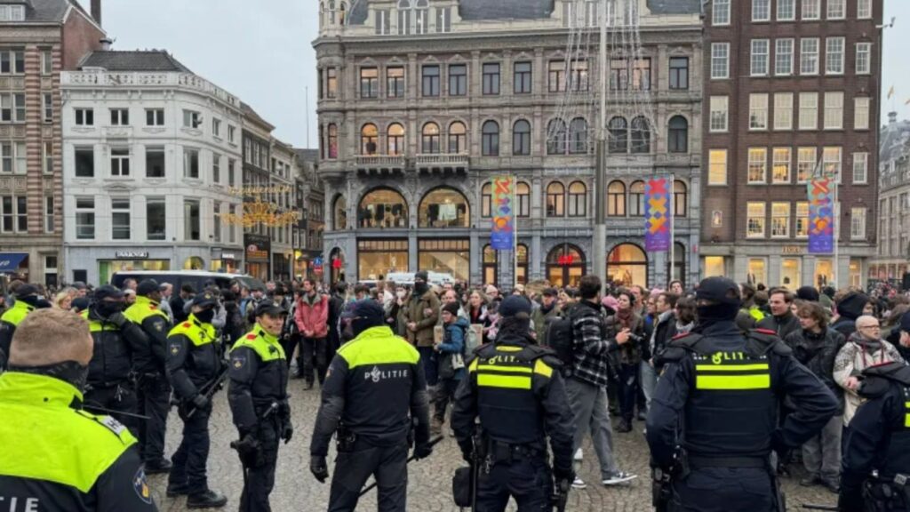 Pro-Palestinian protesters confront Dutch police during a banned demonstration in Amsterdam, Netherlands.