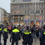 Pro-Palestinian protesters confront Dutch police during a banned demonstration in Amsterdam, Netherlands.