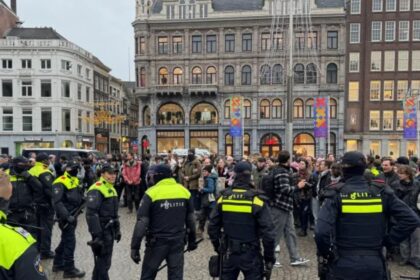 Pro-Palestinian protesters confront Dutch police during a banned demonstration in Amsterdam, Netherlands.